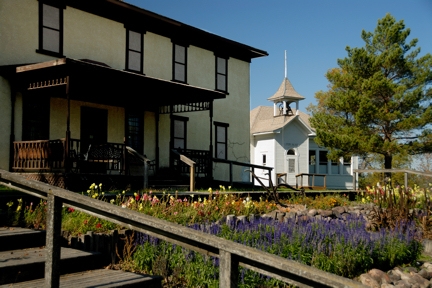 Flowers in front of a historic building along the Chan SanSan Scenic Backway