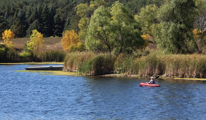 Red kayak paddling in the James River along the Chan SanSan Scenic Backway