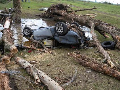 Tornado damage to vehicle and trees